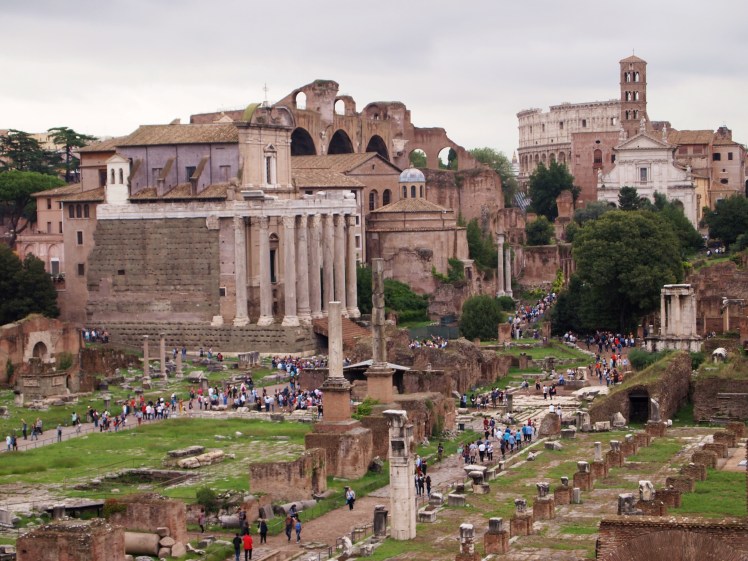 View of the Forum with the Colosseum in the background. 