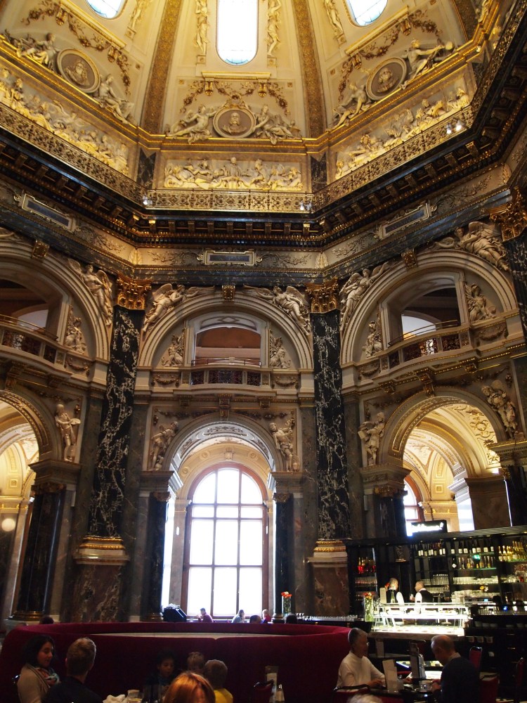 The main rotunda of the Kunsthistorisches Museum is home to a cafe, and is topped with an almost 200-foot-tall cupola. 